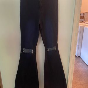 Flare leg with holes in the knees. Purchased from Flamingo. Size small.